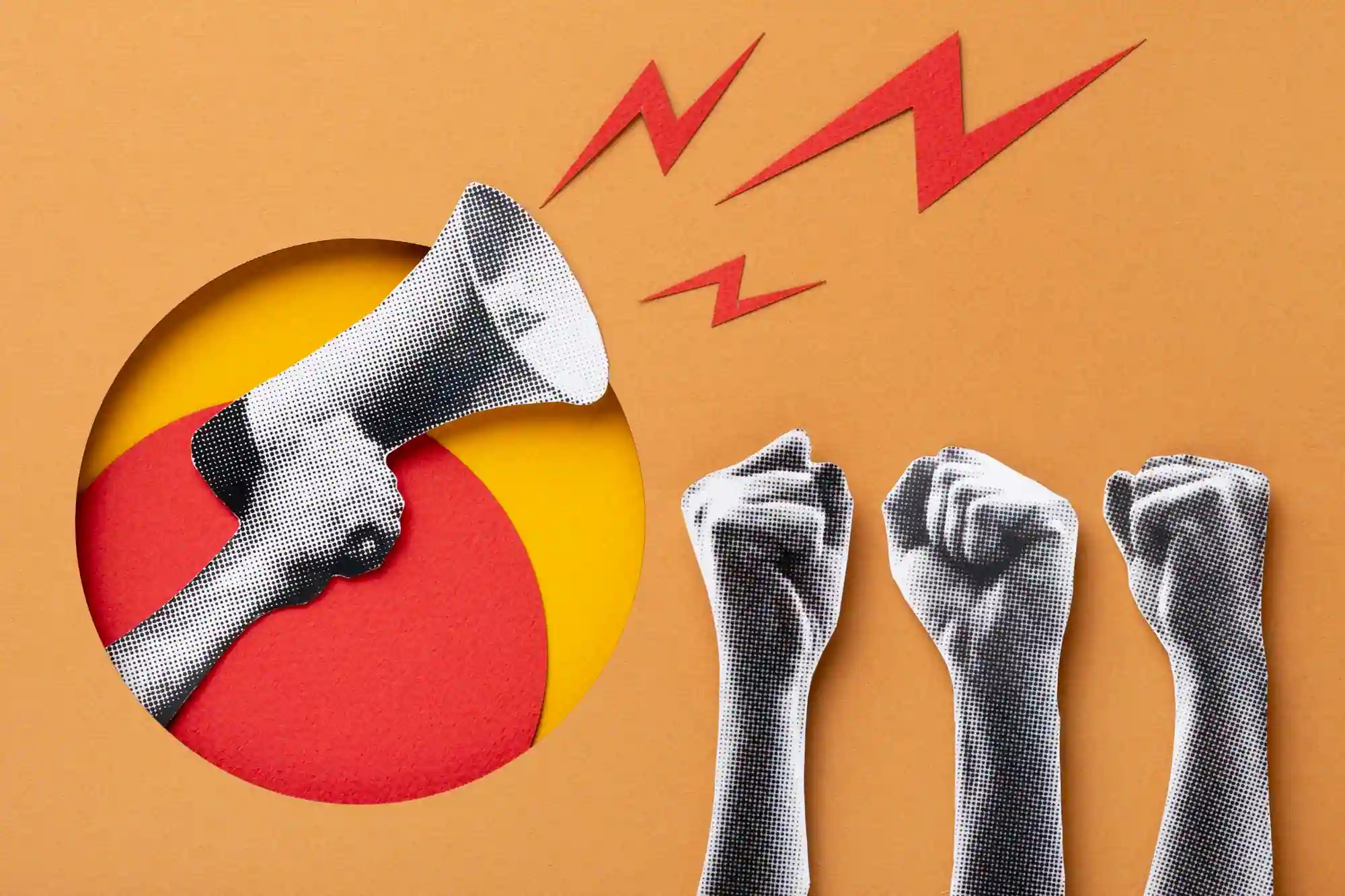 Raised megaphone and clenched fists symbolize protest, unity, and the power of collective voice.