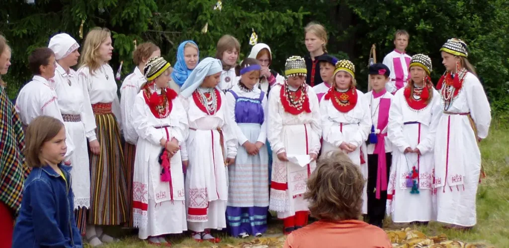 Votian people in traditional clothing during a cultural celebration.