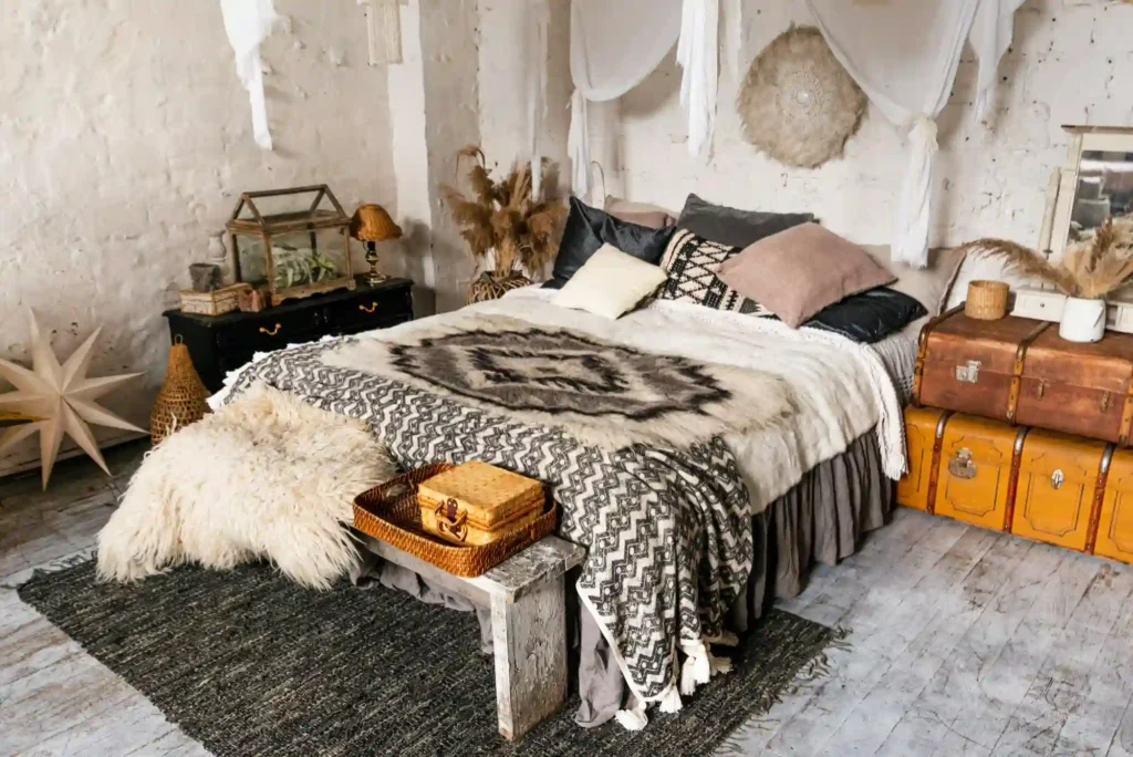 cozy bedroom textures with knit blanket, velvet cushions, and soft rug