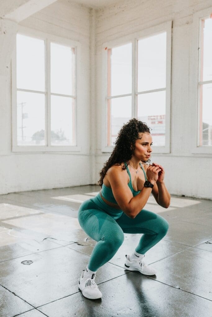 A woman doing bodyweight squat